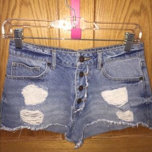 Short short with extra buttons. Perfect condition.